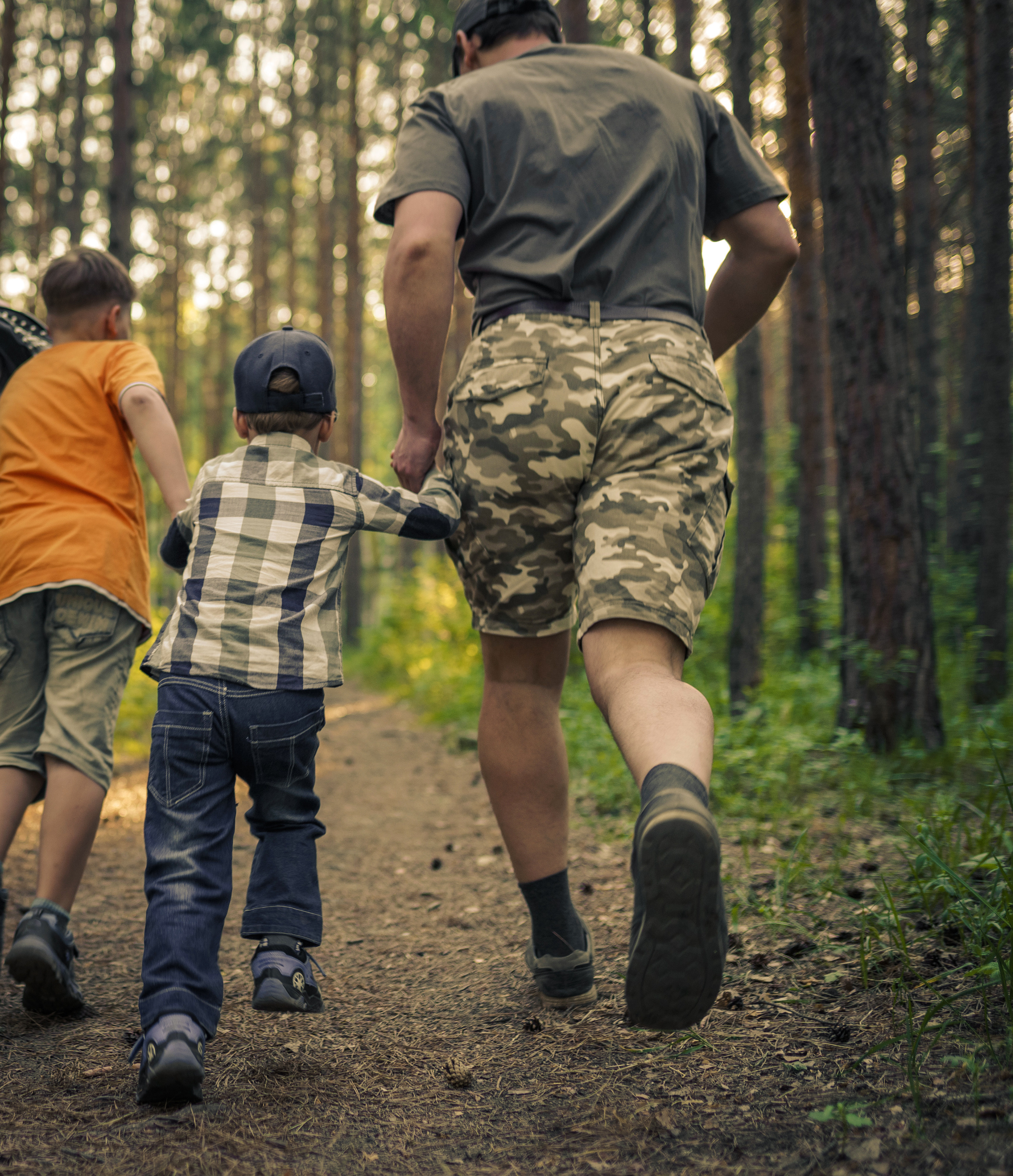 Veteran walking a trail with family